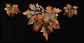 A vintage signed Weiss gold-tone figural enamel decorated Maple leaf brooch and earring set.