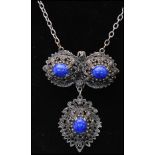 A 1960s silver-tone filigree bracelet and necklace set. The bracelet having four links with blue and