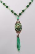 A 1930s Czech Neiger Egyptian revival sautoir necklace strung with peaking glass beads with filigree