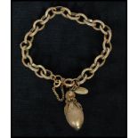 A 1940s signed Miriam Haskell gold-tone acorn charm bracelet having safety chain and spring hoop