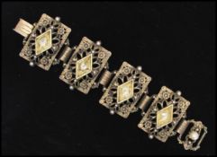 A 1950s silver tone Selini bracelet set with diamond cut yellow stones with clip clasp. Measures 7