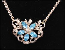 A 1950s vintage rhinestone flower necklace and earring set. Necklace measures approx 6 inches.