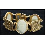 A 1950's goldtone good quality metal Egyptian revival bracelet having thermoset scarab cabochon