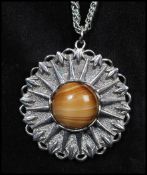 Two vintage silver- tone medallion pendant necklaces to include one set with an agate cabochon the