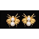 A vintage pair of signed Napier gold-tone bee bug brooches set with faux pearl with hexagonal design
