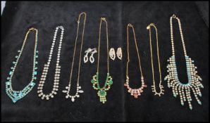 A quantity of rhinestone set jewellery to include necklace and earrings. Longest necklace measures