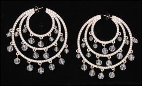 A pair of 1970s signed large sterling silver Christian Dior hoop earrings with paste dangles in