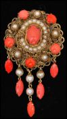 A mid 20th century Czech filigree brooch pin set with coral coloured cabochons and faux pearls