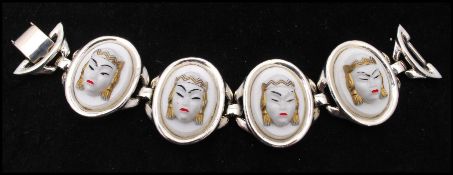 A signed Selini silver-tone 5 link white Asian princess bracelet. Measures 7 inches.