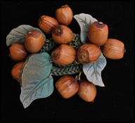 A 1930s Miriam Haskell / Frank Hess cluster brooch pin having carved wooden hazelnuts sewn to a