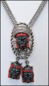 A 1950s Selro Selini Asian Princess lariat slide necklace together with matching earrings.