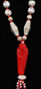 A 1930s Czech Neiger brothers Egyptian revival red and cream glass bead sautoir necklace strung with