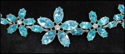 A vintage signed rhinestone set necklace having large aqua blue rhinestone flowers with rhinestone