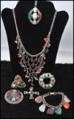 A collection of vintage Scottish agate jewellery to include a white metal bib necklace, a pendant