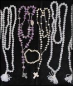 A selection of 5 quartz prayer bead necklaces together with an amethyst rosary and a quartz rosary.