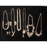 A quantity of rhinestone set jewellery to include necklace and earrings. Longest necklace chain