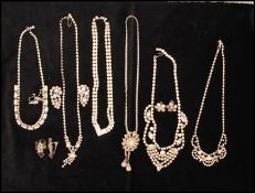 A quantity of rhinestone set jewellery to include necklace and earrings. Longest necklace chain
