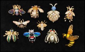 A collection of vintage bug brooches having enamel, rhinestone, ab rhinestone decorated styles, to