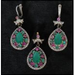 A 925 silver ruby and synthetic emerald earring and pendant set. Marked 925. Pendant approx 4cm.