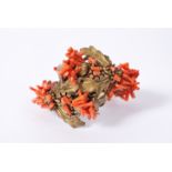 A vintage Frank Hess / Miriam Haskell spezzati coral coil bracelet having gold tone thistle