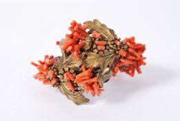 A vintage Frank Hess / Miriam Haskell spezzati coral coil bracelet having gold tone thistle