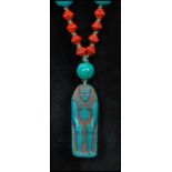 A 1930's Czech Egyptian revival pendant necklace strung with peaking glass and red reeded glass