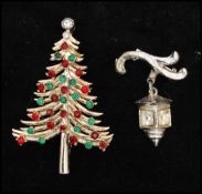 A 1950s vintage signed Christmas tree brooch, signed Dodds together with a rhinestone lantern