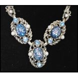 Vintage Selro Selini New York silver-tone necklace being set with blue confetti cabochons with
