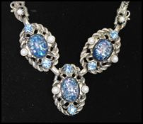 Vintage Selro Selini New York silver-tone necklace being set with blue confetti cabochons with