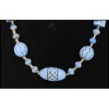 A 1920's Czech blue uranium glass bead necklace. Possibly Neiger brothers. Measures approx 30