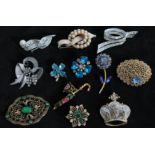 A collection of vintage brooch pins to include signed silver-tone Krasne of California, signed