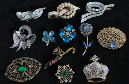 A collection of vintage brooch pins to include signed silver-tone Krasne of California, signed