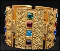 A vintage signed Sphinx Egyptian revival gold-tone bracelet set with square cut coloured glass