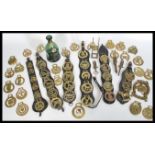 A collection of horse brasses of various designs d