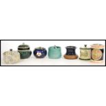 A collection of vintage tobacco jars to include a