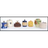 A selection of vintage tobacco jars to include a h