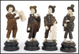A LATE 19TH CENTURY GERMAN BLACK FOREST & IVORY MUSICIAN GROUP