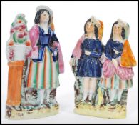 A PAIR OF 19TH CENTURY VICTORIAN STAFFORDSHIRE FLAT BACK FIGURES