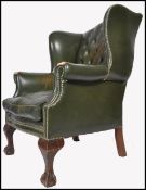 19TH / 20TH CENTURY GREEN STUDDED LEATHER CHESTERFIELD WINGBACK ARMCHAIR