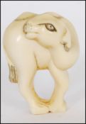 MEIJI PERIOD JAPANESE CARVED IVORY NETSUKE OF A BACTRIAN CAMEL