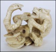 JAPANESE MEIJI PERIOD IVORY NETSUKE DRAGON FIGHTING WITH SNAKE AND RAT