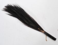 An early 20th Century African tribal zebra tail / horse hair fly swat / swish, the hardwood handle