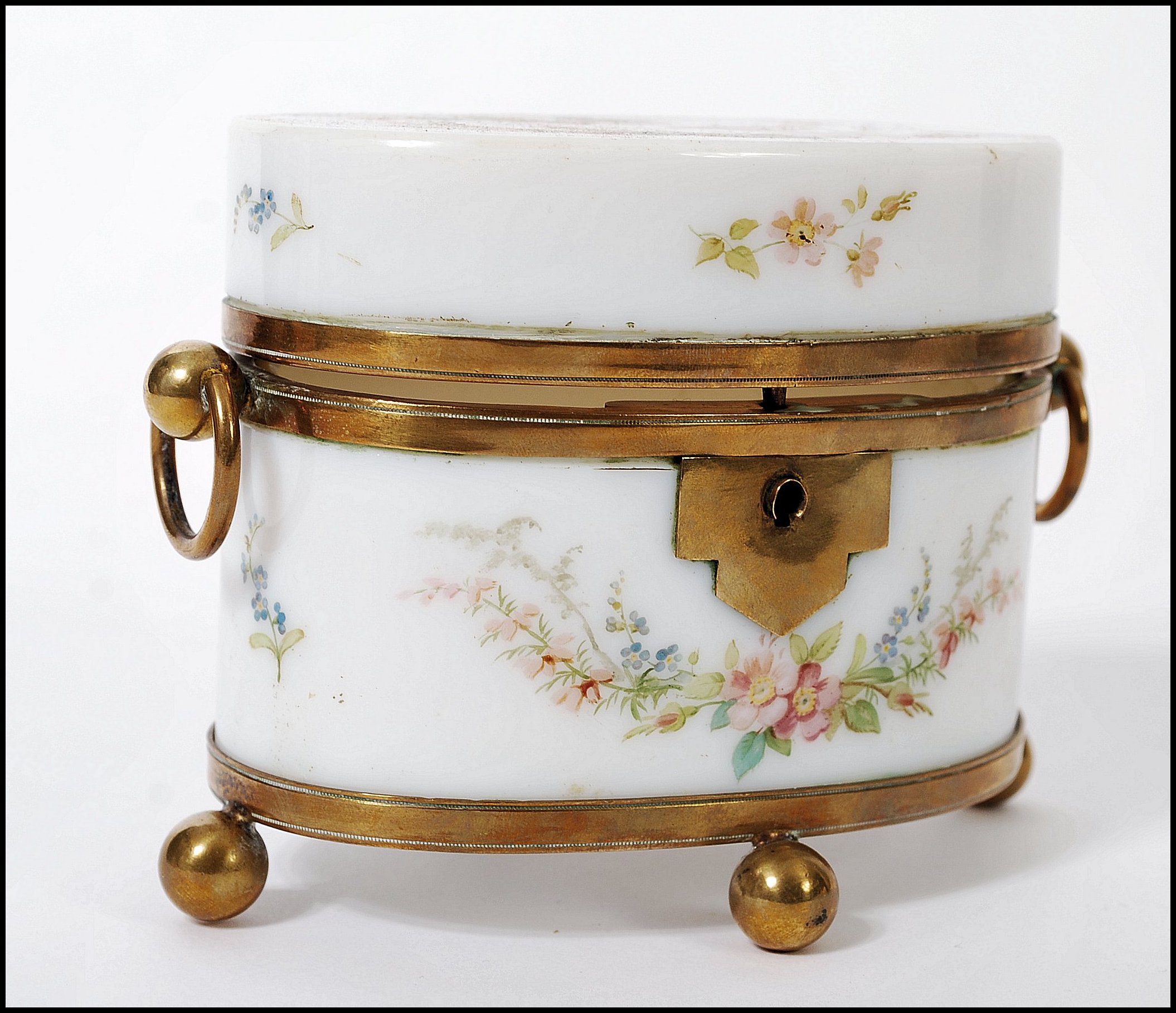 An early 19th century Continental Milch glass ( milk glass ) casket box having ormolu feet and