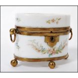 An early 19th century Continental Milch glass ( milk glass ) casket box having ormolu feet and