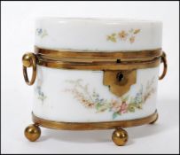 An early 19th century Continental Milch glass ( milk glass ) casket box having ormolu feet and