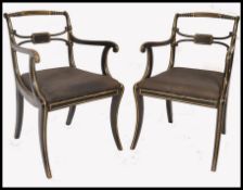 19TH CENTURY REGENCY EBONISED AND GILT PARCEL ARMCHAIRS