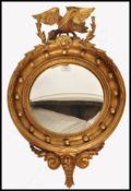 REGENCY 19TH CENTURY GEORGE III EAGLE ADORNED CONVEX WALL MIRROR