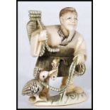 JAPANESE MEIJI PERIOD IVORY CARVED NETSUKE - FISHERMAN WITH BASKET