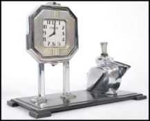 A stunning 20th Century Art Deco combined chromed desk top clock and lighter by Ronson, the