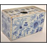 18TH CENTURY ENGLISH DELFT BLUE AND WHITE FLOWER BRICK